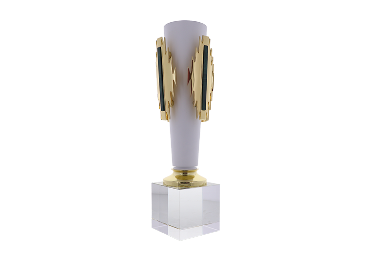 Raised gold and black Aztec inspired pattered on a tapered white cylinder atop a clear base